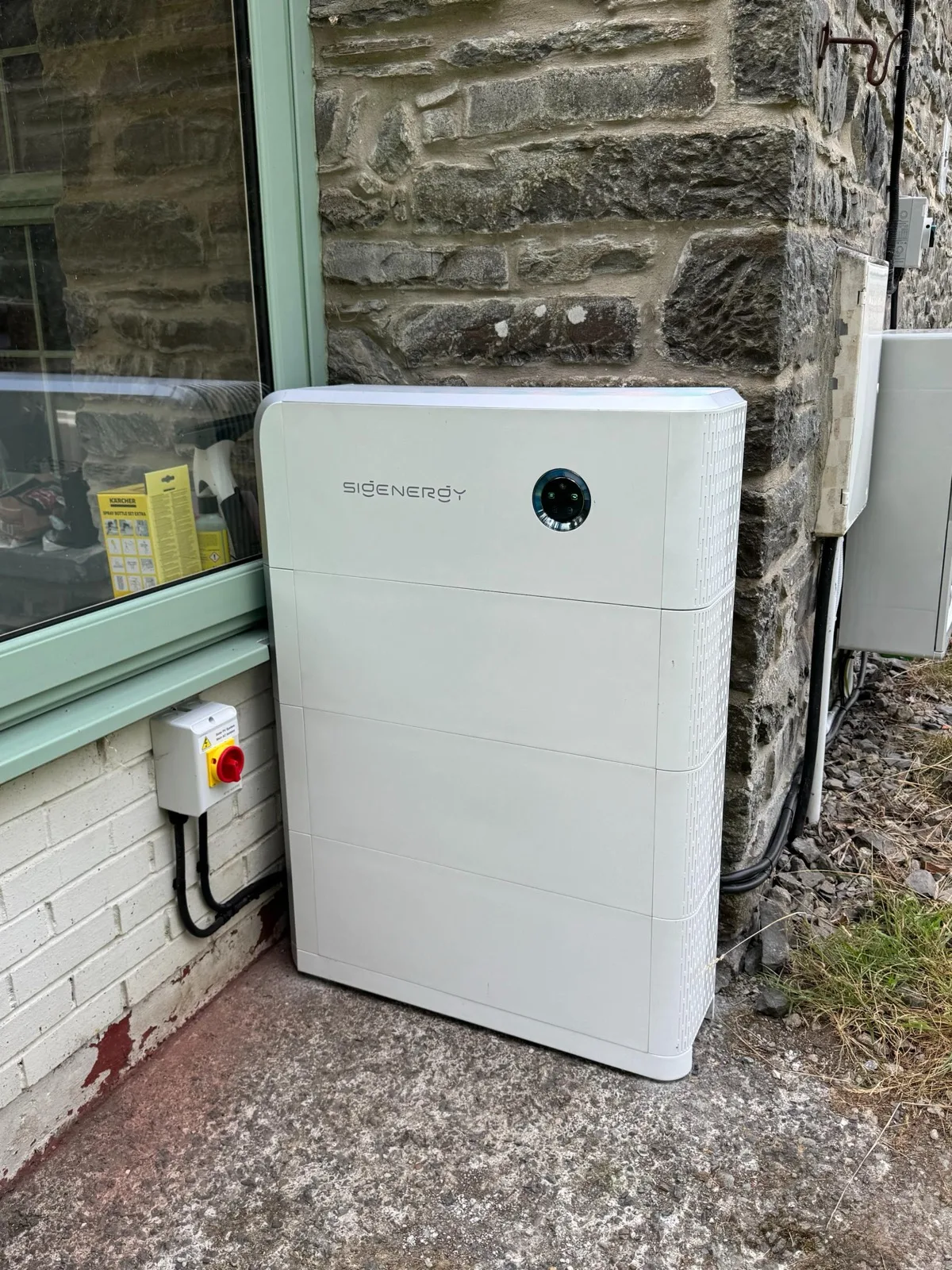 Sigenergy SigenStor battery installed on a stone-walled Welsh home