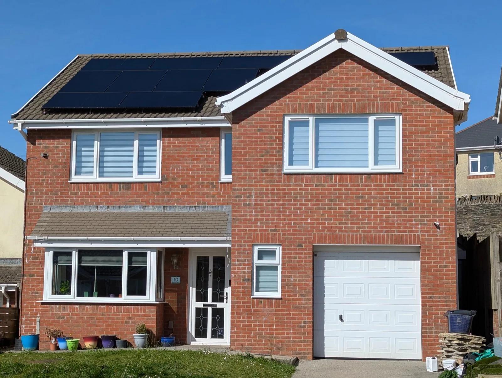 Recent solar PV installation on a detached home in South Wales — all-black panels